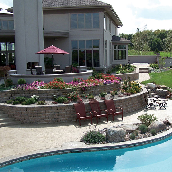 stone accents and landscaping by pool